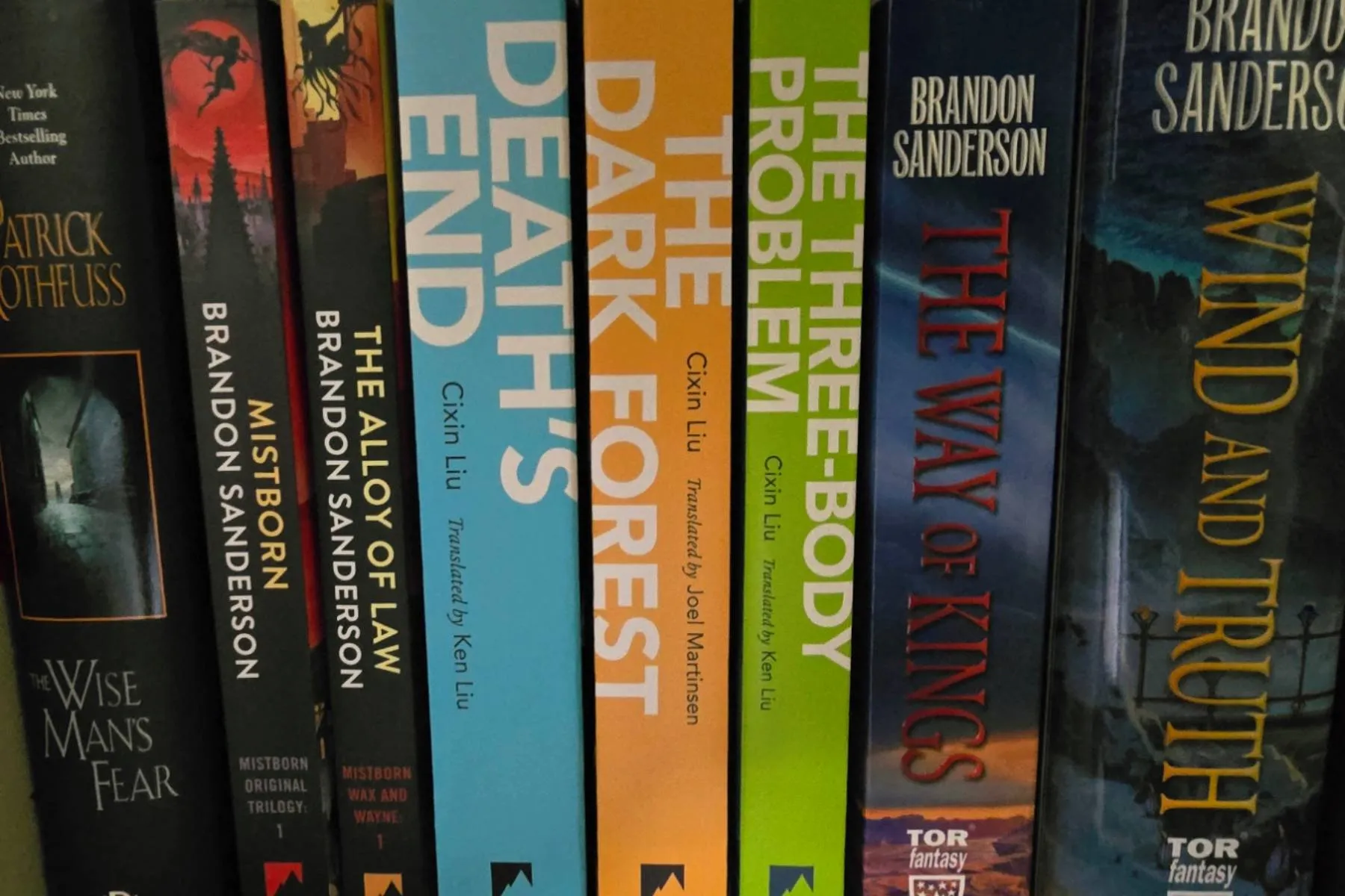A bookshelf of fantasy and science-fiction novels, spines out.
